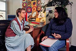 Photo of Margaret Elowson and Luz Adriana Torres discussing undergraduate research opportunities