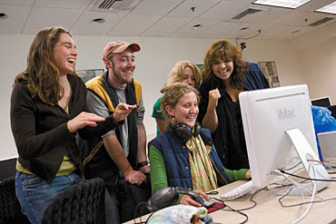 Photo of students working on their films