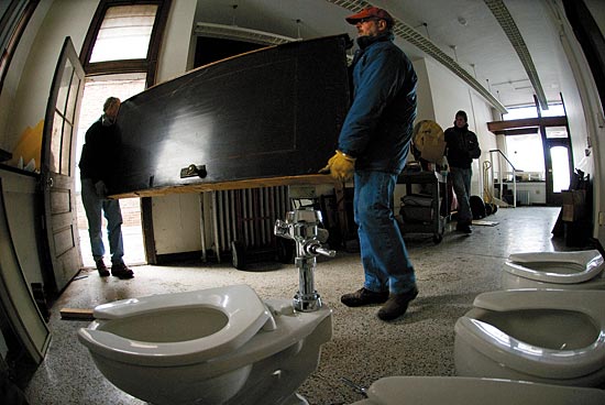 Photo of workers remving material from the future site of the Wisconsin Institutes of Discovery