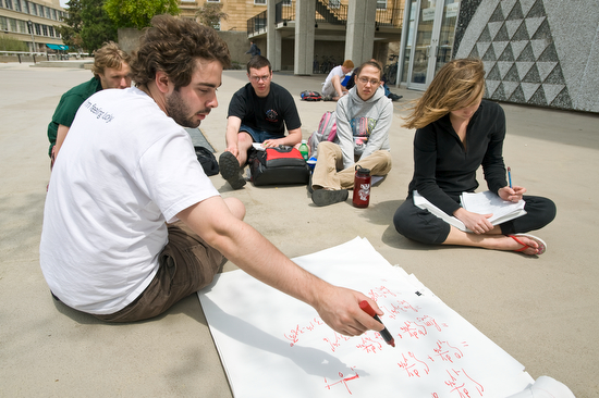 Photo of math tutors and students on sidealk by Van Vleck