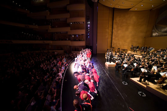 The crowd applauds as more than 200 performers take their final bow.