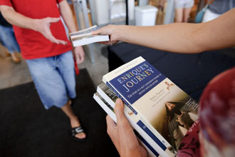 Photo of students receiving a copy of &ldquo;Enrique&rsquo;s Journey&rdquo;