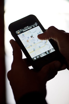 Photo: person holding smart phone