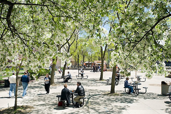 Photo: people at outdoor tables on State Street mall on UW-Madison campus