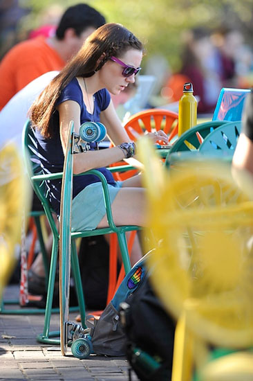 Photo of a student studying at the Memorial Union Terrace.