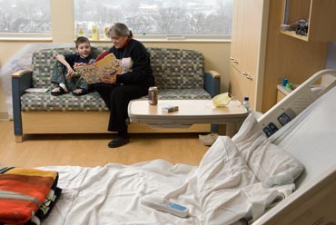 Photo of librarian reading to pediatric patient 