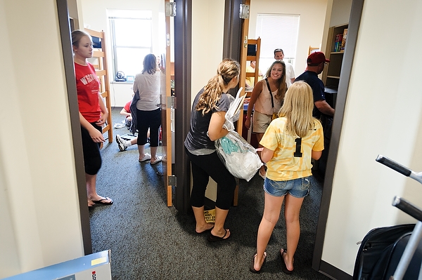 Howdy, neighbor! Students get to know their neighbors as they settle into rooms within the new Dejope Residence Hall.