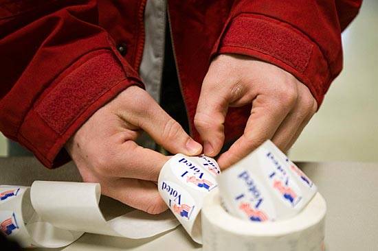 Photo of peling I voted sticker off roll