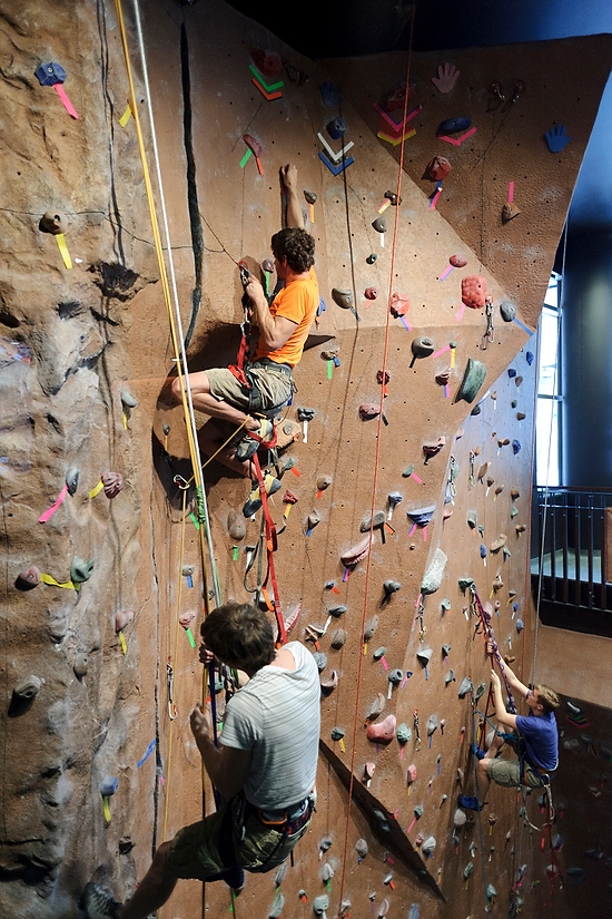 Photo: students ascending rock-climbing wall in Union South