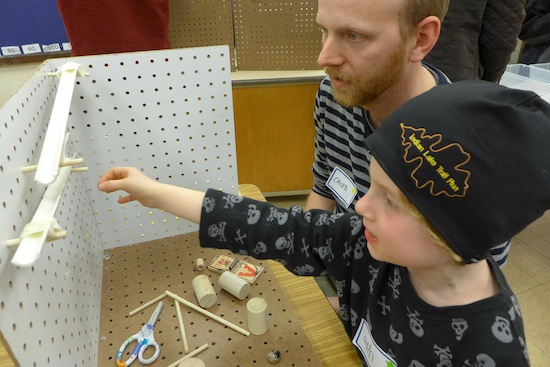 Photo: student and parent with Rube Goldberg contraption