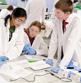 Photo: Middle school students reviewing experiment results