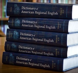 Photo: stack of volumes of Dictionary of American Regional English