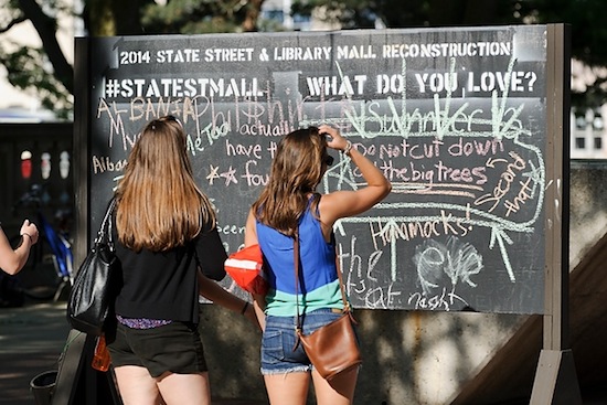 Photo: students facing chalkboard