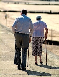 Photo: Elderly couple walking with canes