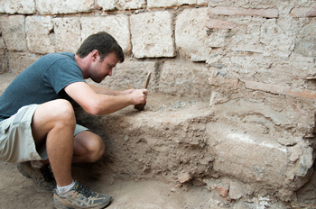 Photo: Will Bruce excavates a coin horde