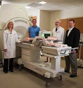 Photo: Employees of Marvel Medtech posing with MRI scanner