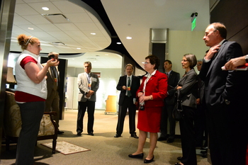 Photo: Tour guide with group at GE Healthcare