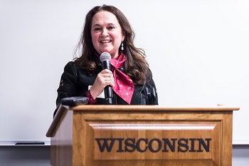 Photo: Emily Auerbach, UW–Madison professor of English and director of the Odyssey Project, makes opening remarks